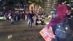 Police and protesters gather around a demonstrator who got shot after several shots were fired during a Black Lives Matter protest in downtown Austin, Texas, U.S., July 25, 2020 in this screen grab obtained from a social media video. ImHiram/Hiram Gilberto/www.imhiram.com/REUTERS   THIS IMAGE HAS BEEN SUPPLIED BY A THIRD PARTY. MANDATORY CREDIT. NO RESALES. NO ARCHIVES.