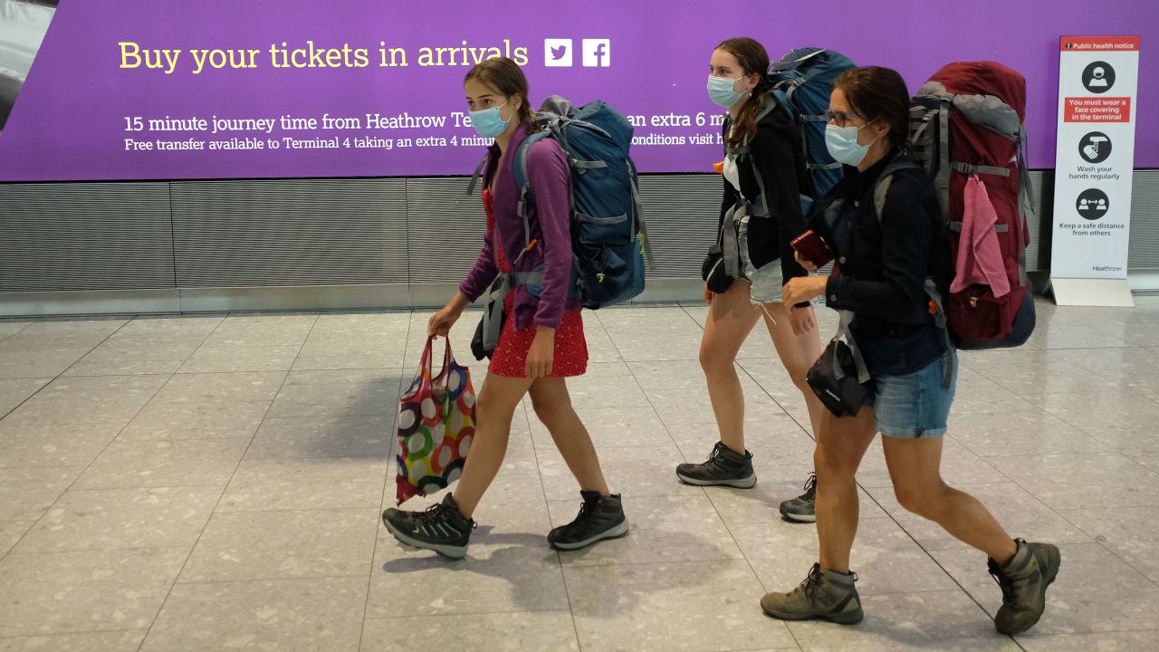 Passengers arrive at Heathrow Airport, London, after their flight from Madrid.  