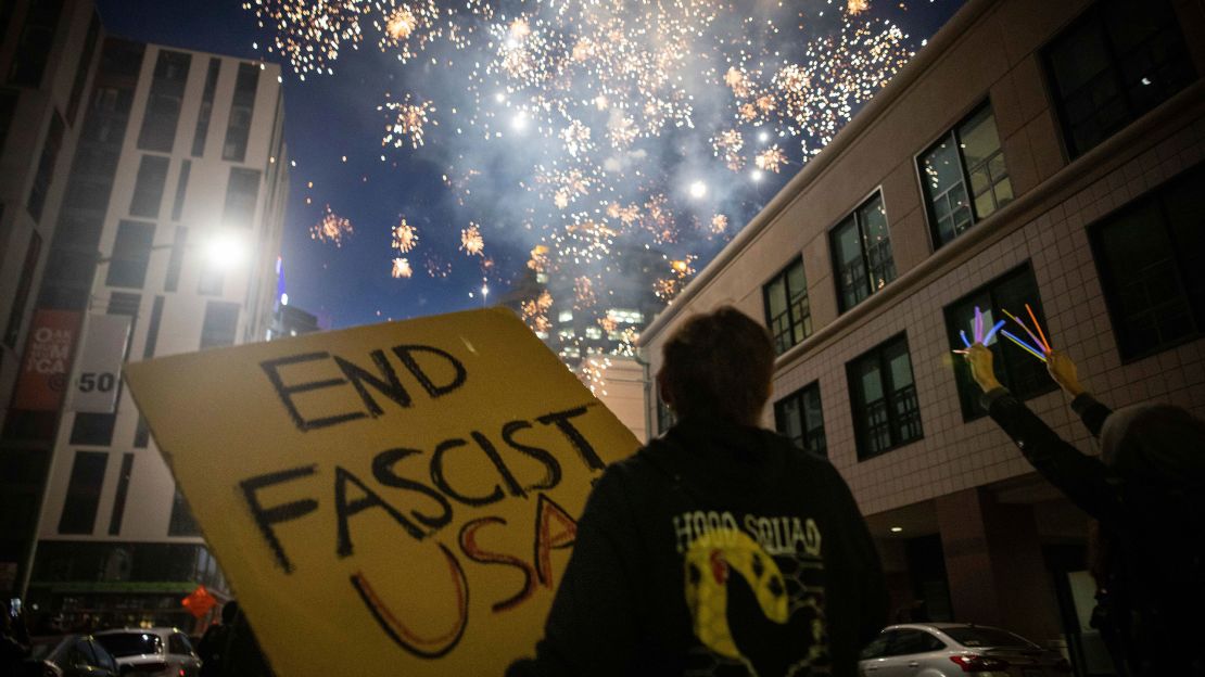 Protesters light fireworks in the middle of downtown Oakland during a protest on Saturday, July 25, 2020, in Oakland, California.