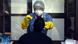 PATNA, INDIA - JULY 14: A medical personnel collects swab sample from a man to test for coronavirus infection, at Gardenal Hospital on July 14, 2020 in Patna, India. (Photo by Parwaz Khan/Hindustan Times via Getty Images)