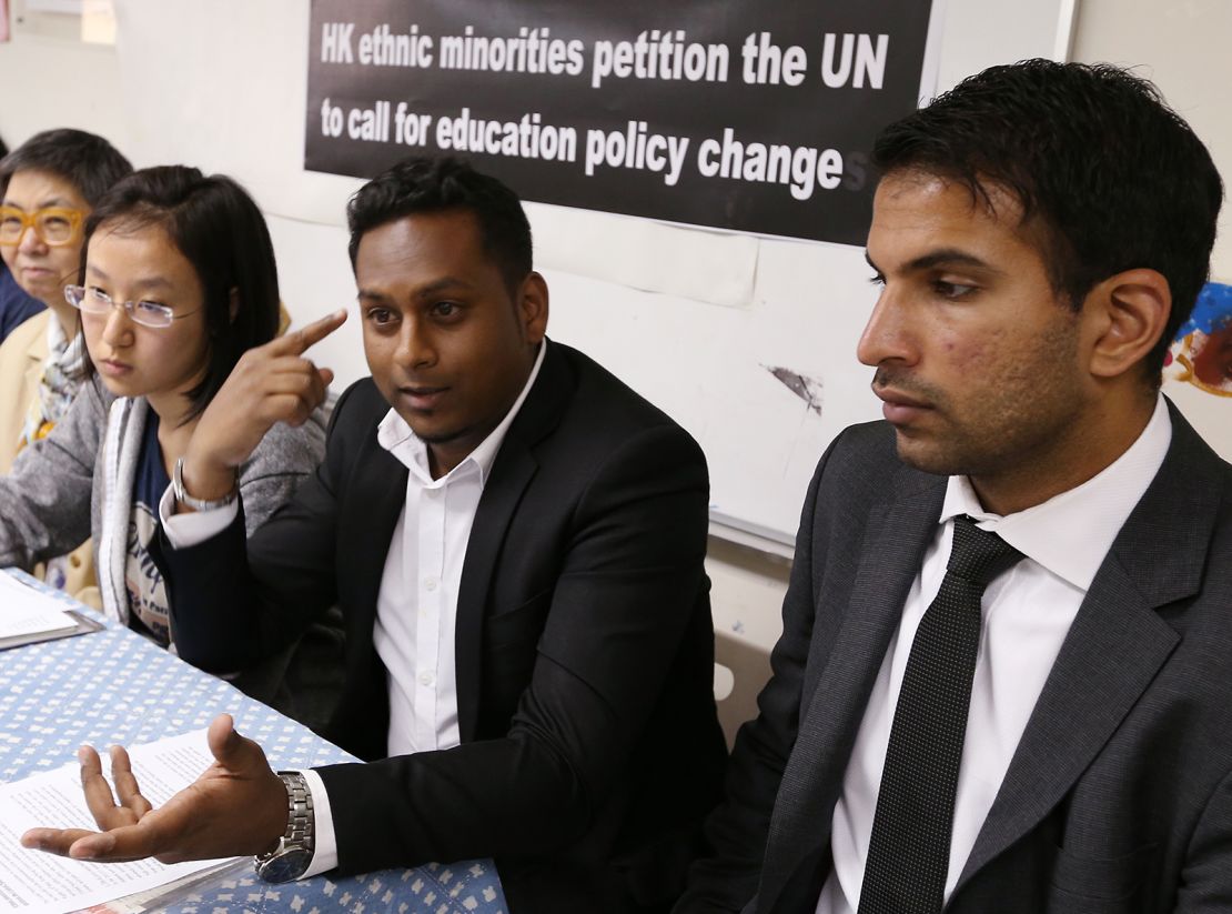Members of the Hong Kong Unison, a nonprofit that helps ethnic minorities, petition the UN to call for education policy change in May 2014, citing racial discrimination.
