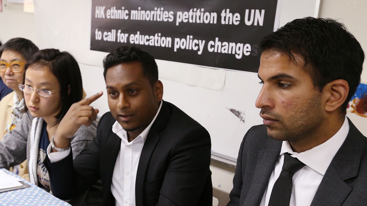 Members of the Hong Kong Unison, a nonprofit that helps ethnic minorities, petition the UN to call for education policy change in May 2014, citing racial discrimination.