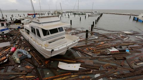 Debris floats around damaged boats in a marina after it was hit by Hurricane Hanna on Sunday in Corpus Christi, Texas.