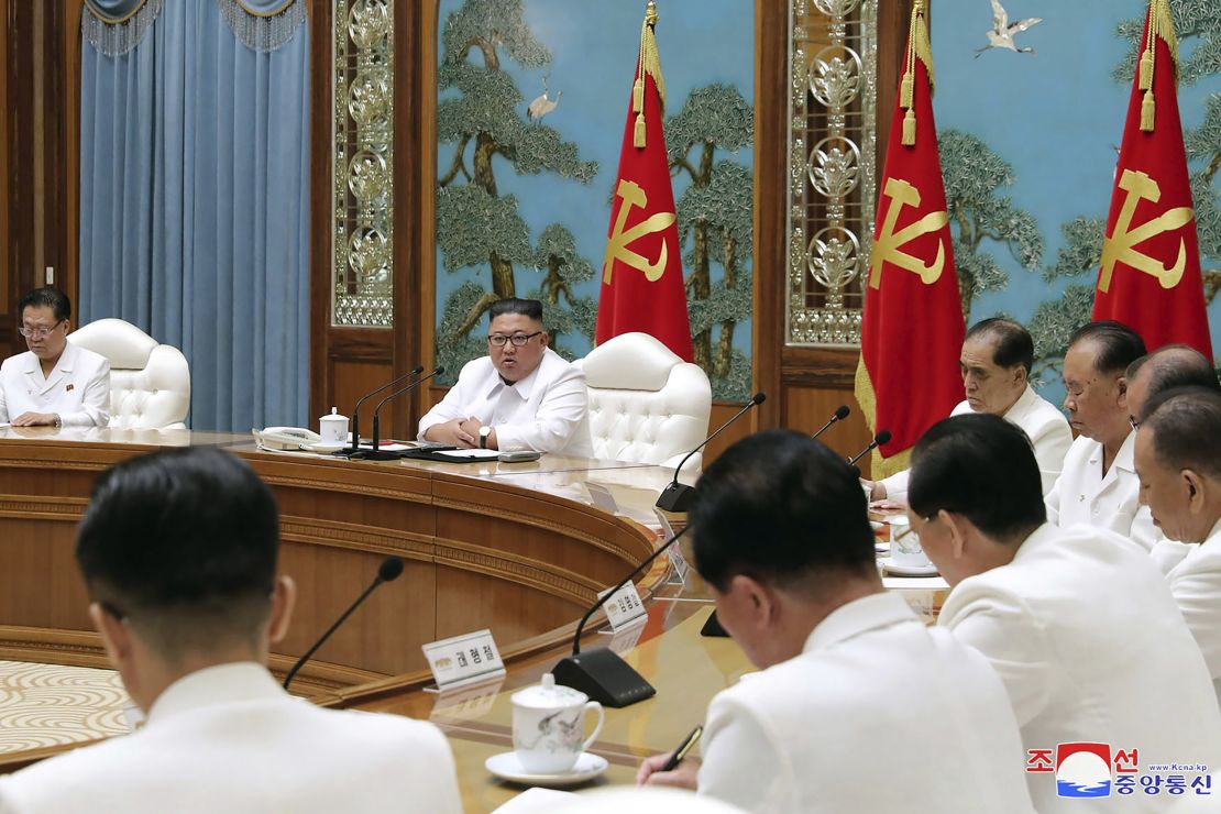 In this photo provided by the North Korean government, North Korean leader Kim Jong Un, second left in the background, attends an emergency meeting in Pyongyang on Saturday.