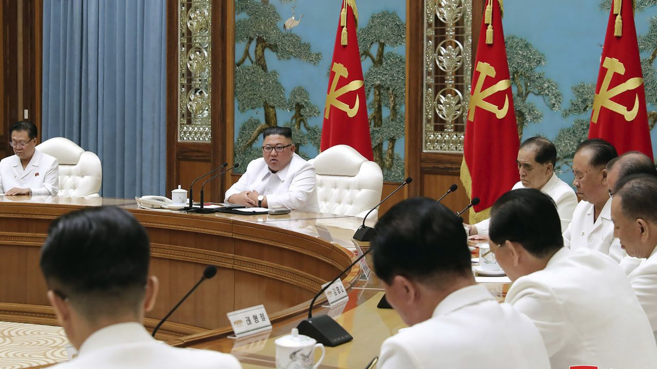 In this photo provided by the North Korean government, North Korean leader Kim Jong Un, second left in the background, attends an emergency meeting in Pyongyang on Saturday.