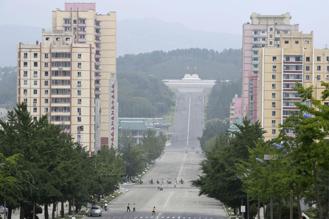 People make their way in the North Korean city of Kaesong in this file photograph from July 23, 2019.