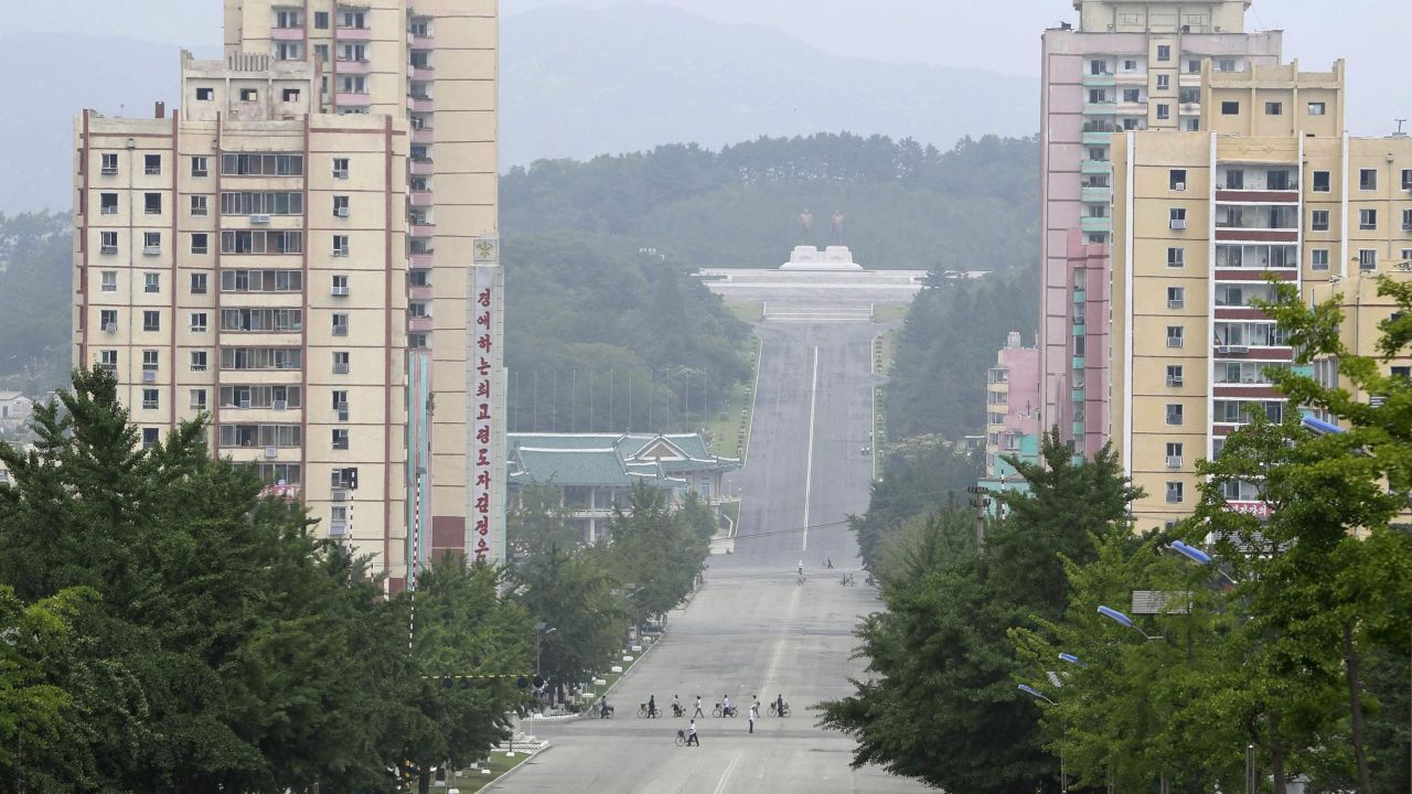 People make their way in the North Korean city of Kaesong in this file photograph from July 23, 2019.