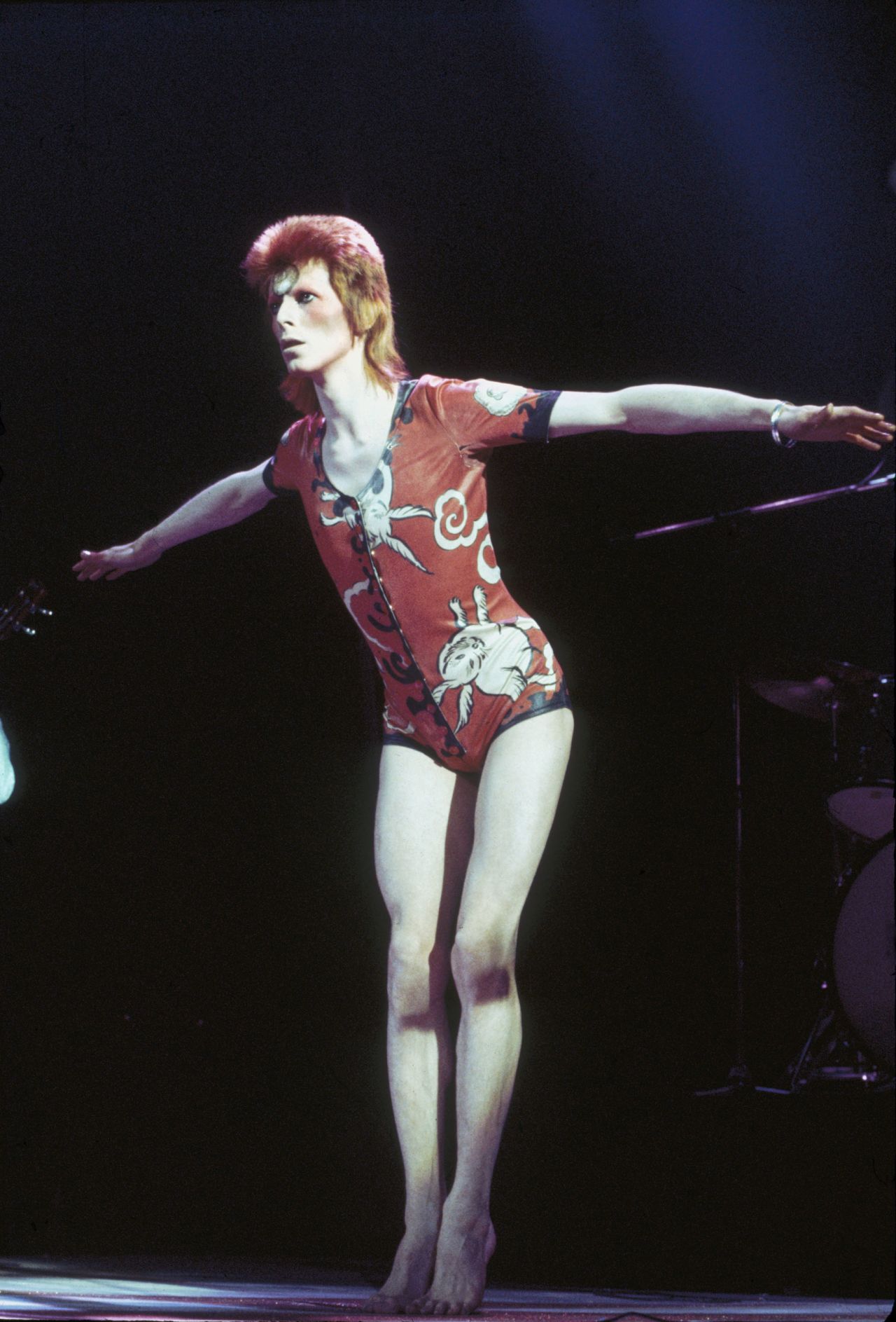David Bowie performing as Ziggy Stardust, in his "woodland creatures" costume designed by Kansai Yamamoto, at the Hammersmith Odeon, 1973.
