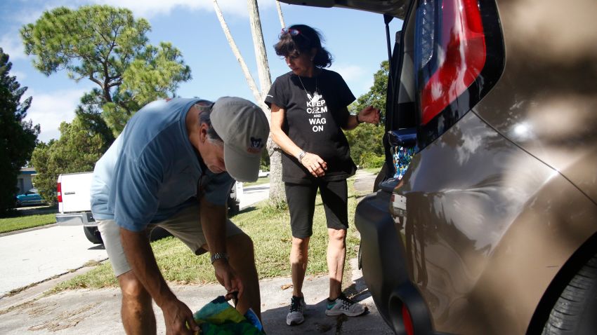ST PETERSBURG, FL -  SEPTEMBER 9:  Vikki Sears and Paul Zielinski load household items and supplies into their car as they comply with a mandatory evacuation ahead of Hurricane Irma on September 09, 2017 in St. Petersburg, Florida. Florida is in the path of the Hurricane which may come ashore at  category 4.  (Photo by Brian Blanco/Getty Images)