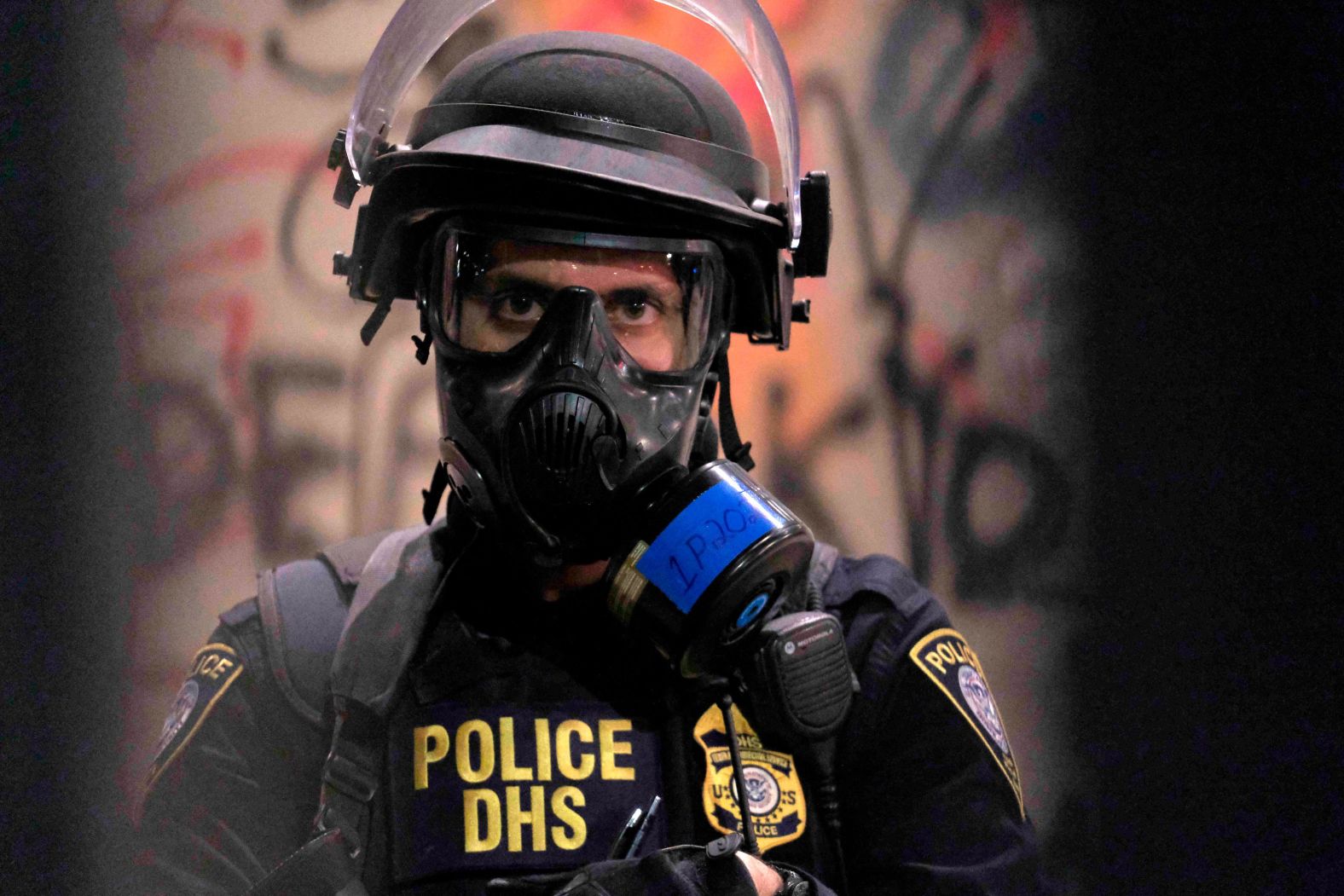 A federal officer monitors the protests on July 25.