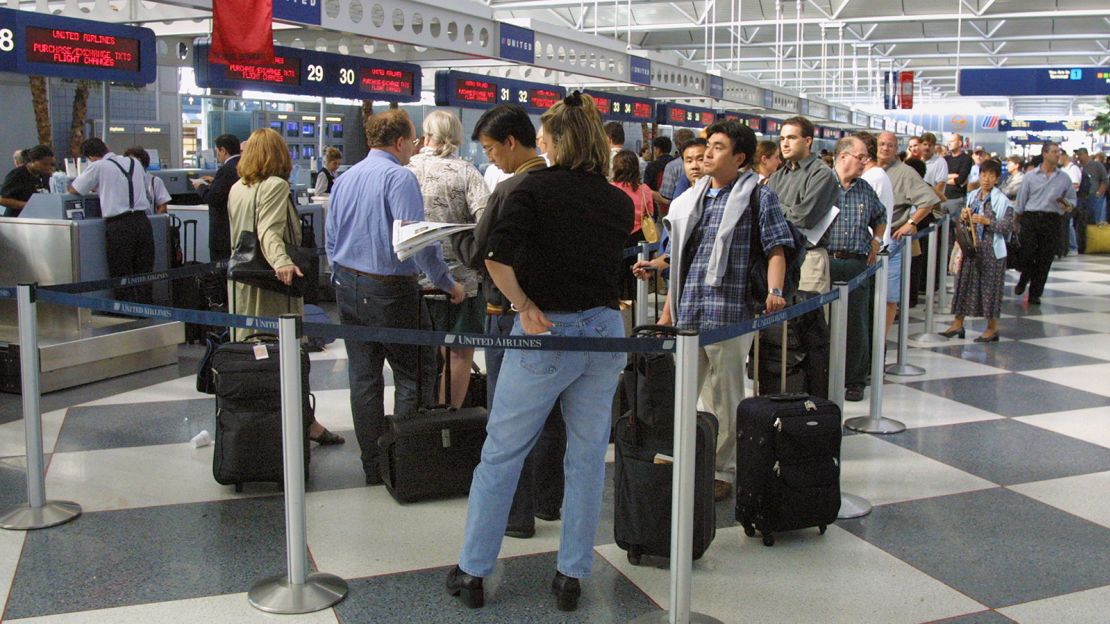 Departing travelers wait in long lines at Chicago's O'Hare International Airport on September 14, 2011, just days after the 9/11 attacks.