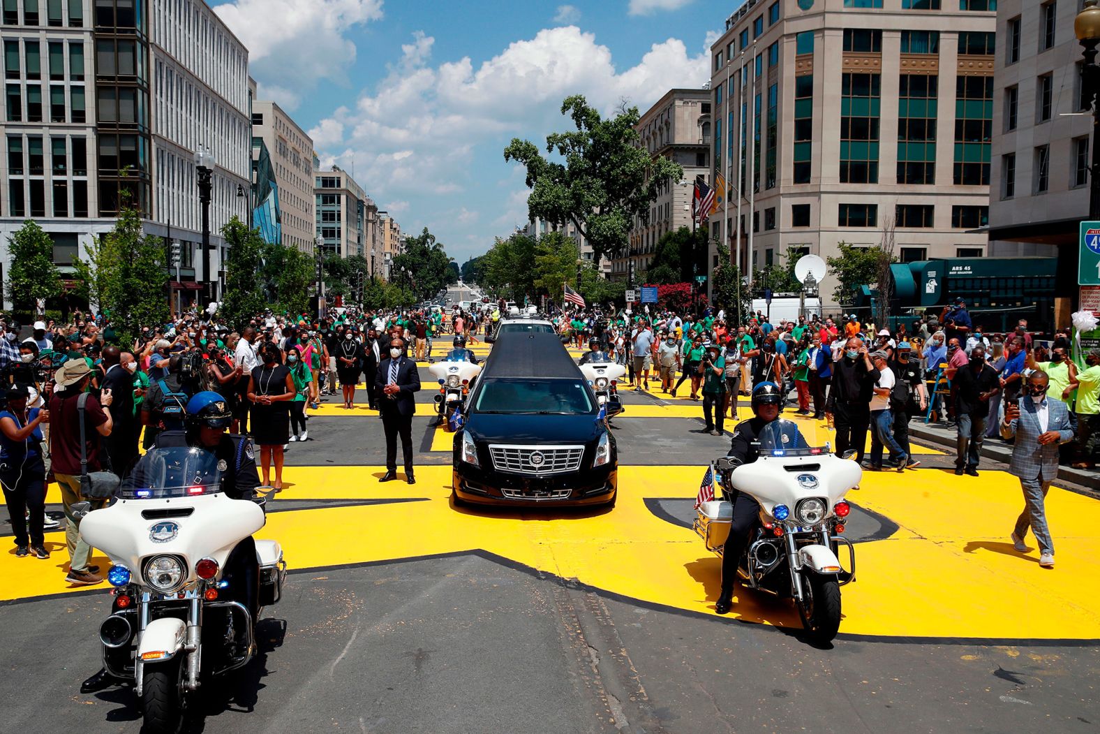 A hearse carrying Lewis' casket drives on Black Lives Matter Plaza, near the White House, on Monday.