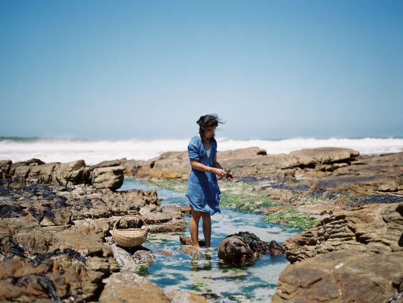 Wild food innovator Roushanna Gray forages in the rock pools along the coastline of the Western Cape. Gray is teaching others how to bring nature to the table.