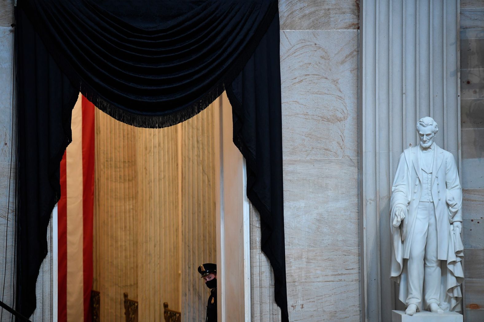 A security guard peers into the Capitol rotunda.