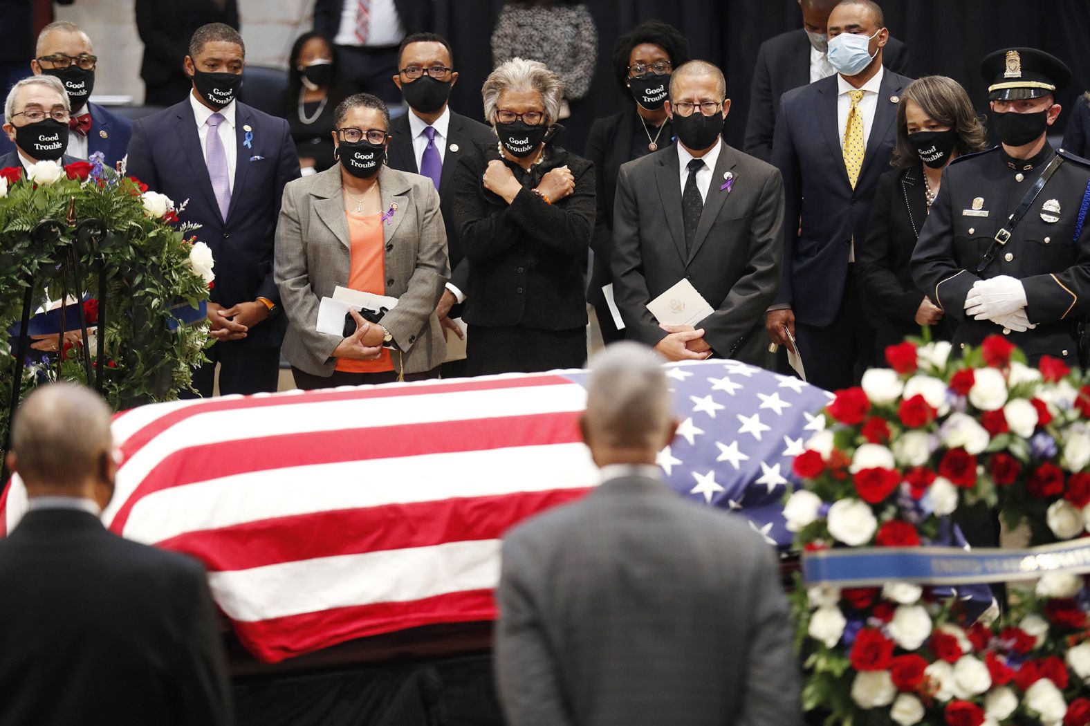 People pay their respects to Lewis at the US Capitol. The masks say "good trouble," which references one of Lewis' favorite sayings. "Never, ever be afraid to make some noise and get in good trouble, necessary trouble," he tweeted in 2018.