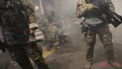 PORTLAND, OREGON - JULY 25: Federal Police arrest protesters in front of the Mark O. Hatfield federal courthouse in downtown Portland as the city experiences another night of unrest on July 25, 2020 in Portland, Oregon. For over 55 straight nights, protesters in downtown Portland have faced off in often violent clashes with the Portland Police Bureau and, more recently, federal officers. The demonstrations began to honor the life of George Floyd and other black Americans killed by law enforcement and have intensified as the Trump administration called in the federal officers. (Photo by Spencer Platt/Getty Images)