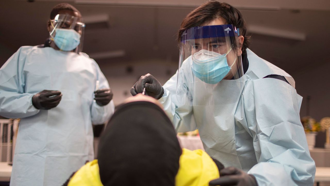 PEMBROKE PARK, FLORIDA - JULY 22:  Health care workers use a nasal swab to test a person for COVID-19 at a pop up testing site at the Koinonia Worship Center and Village on July 22, 2020 in Pembroke Park, Florida. The tests where being donated by the emergency management firm CDR Maguire and GENETWORx Lab as the state of Florida battles against a spike in coronavirus cases. (Photo by Joe Raedle/Getty Images)