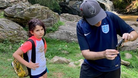 The Levy family goes for a walk -- while watching a Premier League match.
