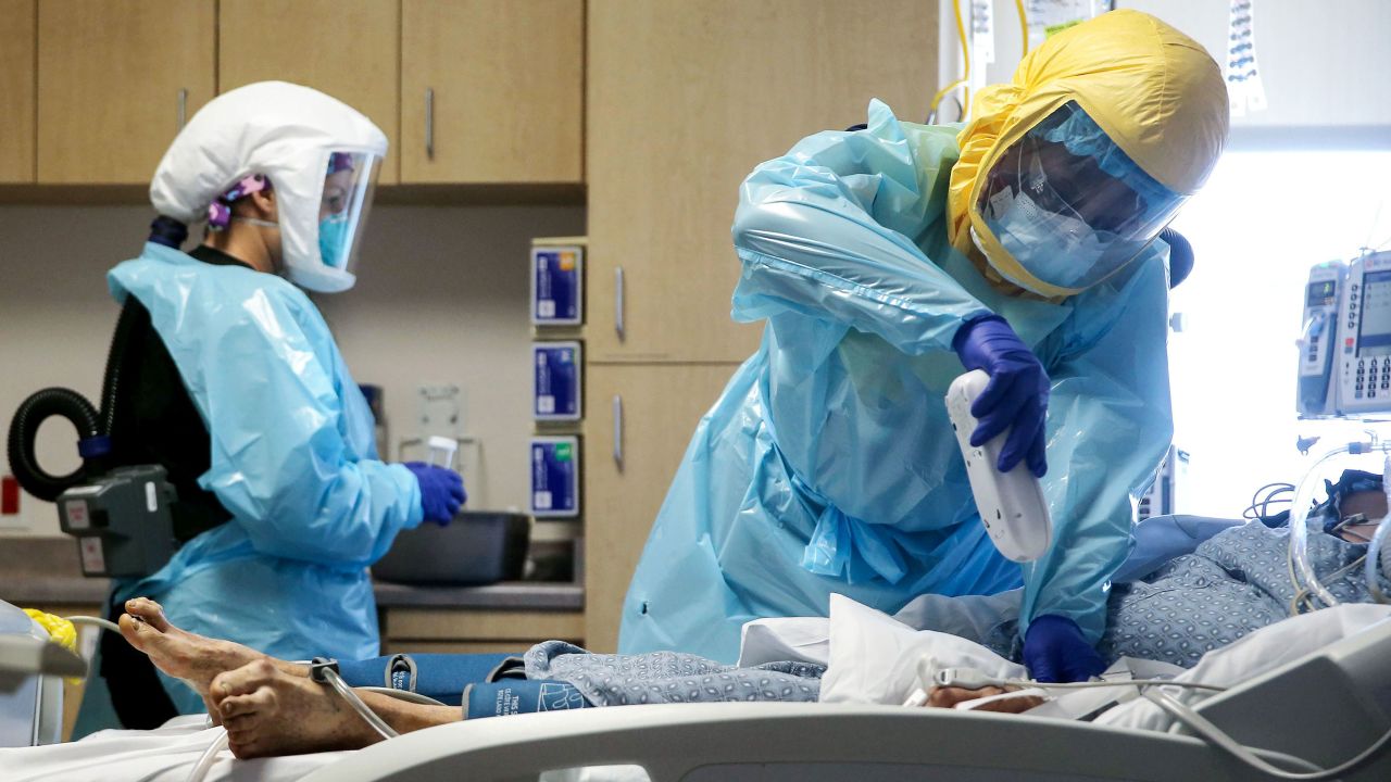 Clinicians care for a COVID-19 patient in the Intensive Care Unit (ICU) at El Centro Regional Medical Center in hard-hit Imperial County on July 21, 2020 in El Centro, California. Imperial County currently suffers from the highest death rate and near-highest infection rate from COVID-19 in California. The rural county, which is 85 percent Latino, borders Mexico and Arizona and endures high poverty rates and air pollution while also being medically underserved. In California, Latinos make up about 39 percent of the population but account for 55 percent of confirmed coronavirus cases amid the pandemic.