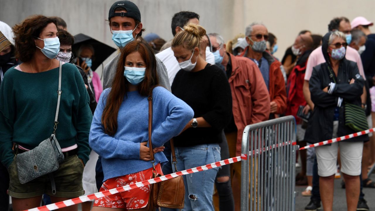 People wait for Covid-19 tests on Monday in the Brittany resort of Quiberon, western France, after a cluster emerged there last week.