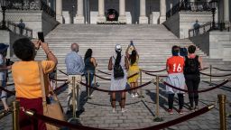 Members of the public view the flag-draped casket bearing the remains of Rep. John Lewis at the east front steps of the U.S. Capitol on July 28, 2020 in Washington, DC.