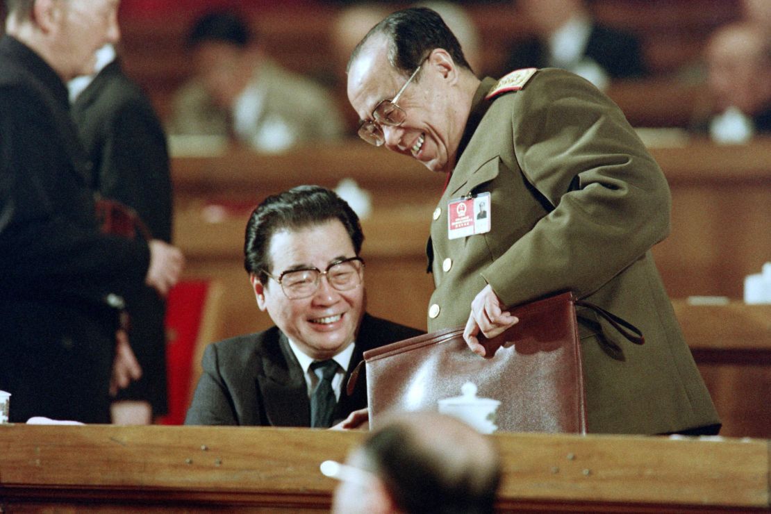 Chinese Prime Minister Li Peng (left) at the National People's Congress on March 21, 1992 in Beijing, China. 