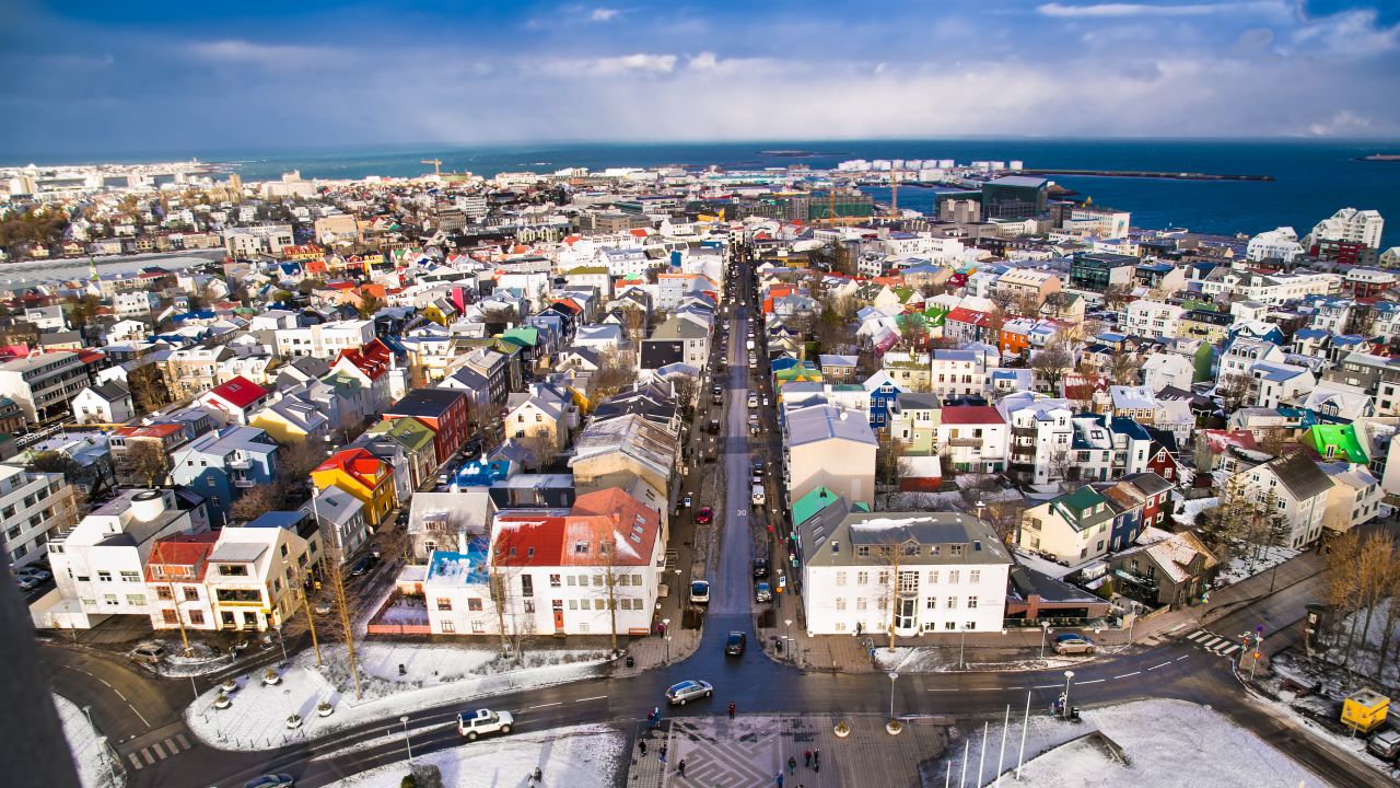 A panoramic view of Reykjavik city and the Atlantic ocean coast from the top of Hallgrimskirkja church.