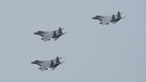 Japan's Air Self-Defense Force's F-15 fighter jets fly during a review after the graduation ceremony of the National Defense Academy on March 22, 2020 in Yokosuka, Japan. 
