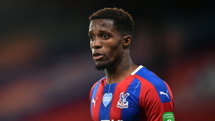 LONDON, ENGLAND - JULY 16: Wilfried Zaha of Crystal Palace looks on during the Premier League match between Crystal Palace and Manchester United at Selhurst Park on July 16, 2020 in London, England. Football Stadiums around Europe remain empty due to the Coronavirus Pandemic as Government social distancing laws prohibit fans inside venues resulting in all fixtures being played behind closed doors. (Photo by Glyn Kirk/Pool via Getty Images)
