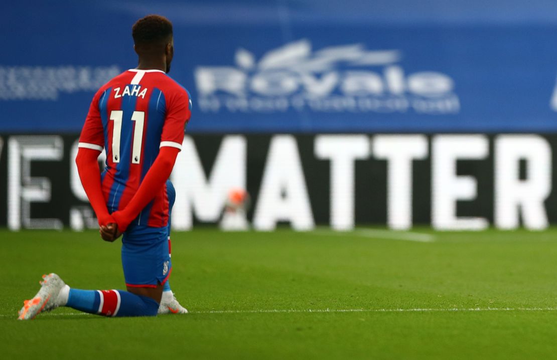 Wilfried Zaha takes a knee in support of the Black Lives Matter movement before the matcha against Burnley.