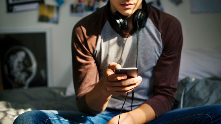 teenager using smartphone STOCk