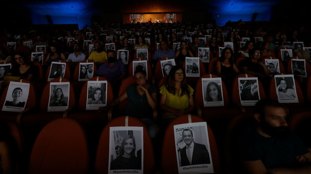 Portraits are taped onto seats to help theatergoers spread out in Nicosia, Cyprus, on July 27.