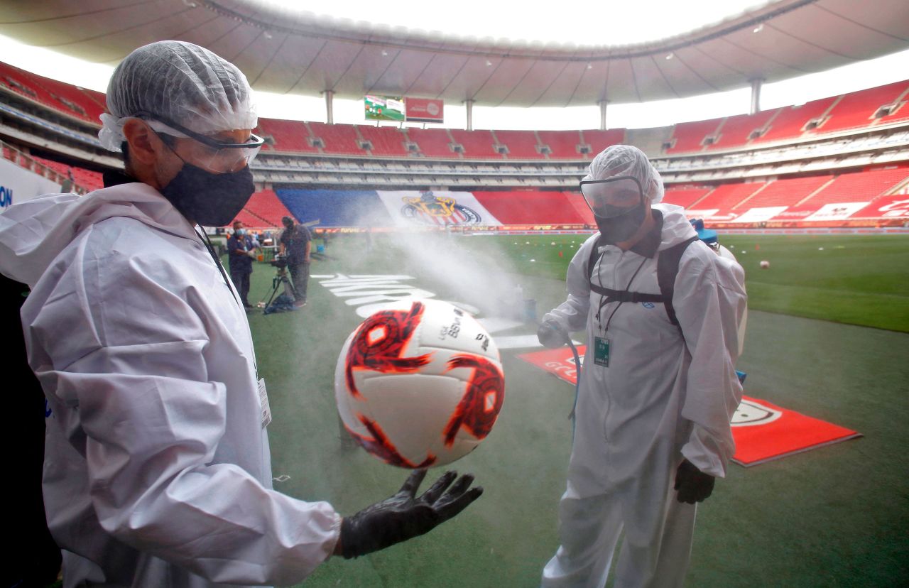 A soccer ball is disinfected before the beginning of a professional match in Guadalajara, Mexico, on July 25.