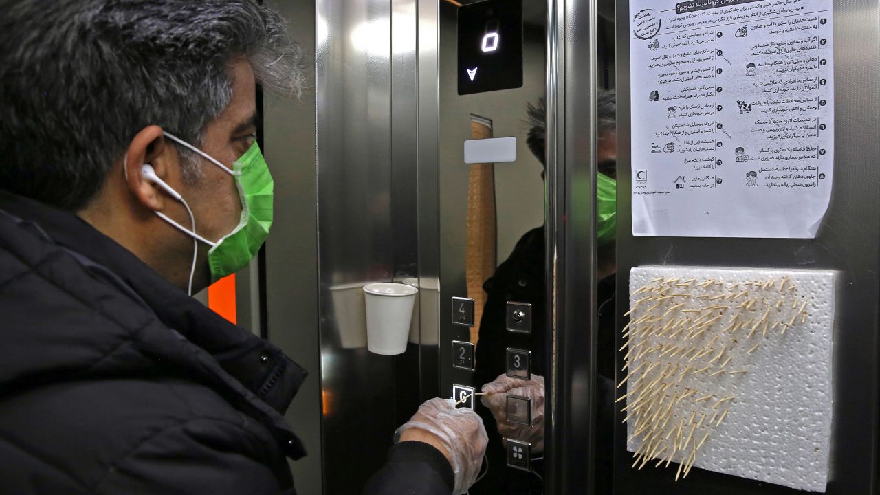 People worldwide are finding ways to avoid touching elevator buttons. This man in Tehran is using toothpicks.
