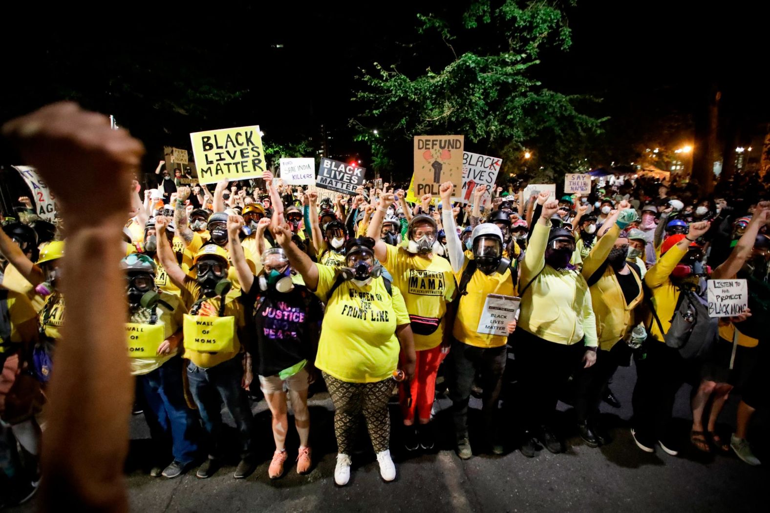 The "Wall of Moms" protest group marches with other demonstrators on July 28.