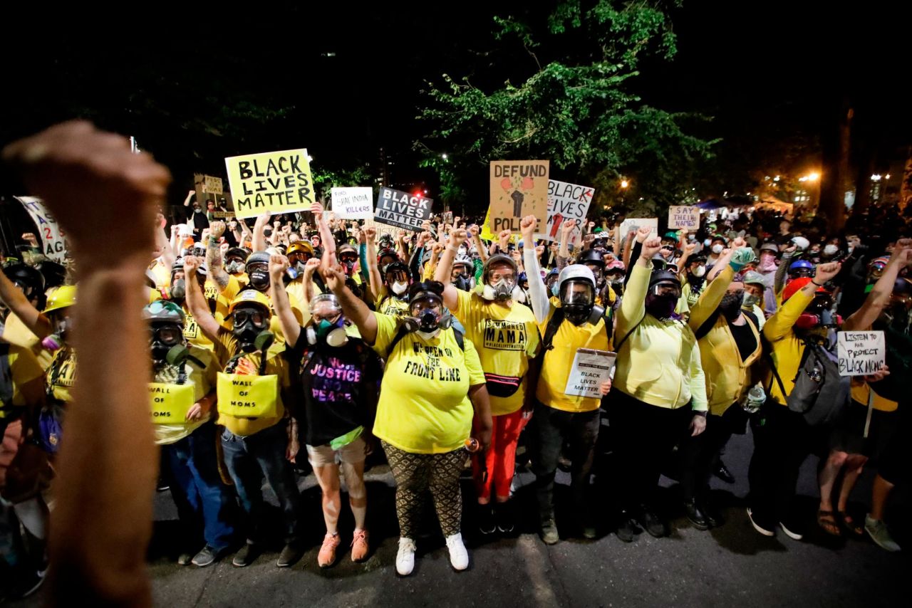The "Wall of Moms" protest group marches with other demonstrators on July 28.