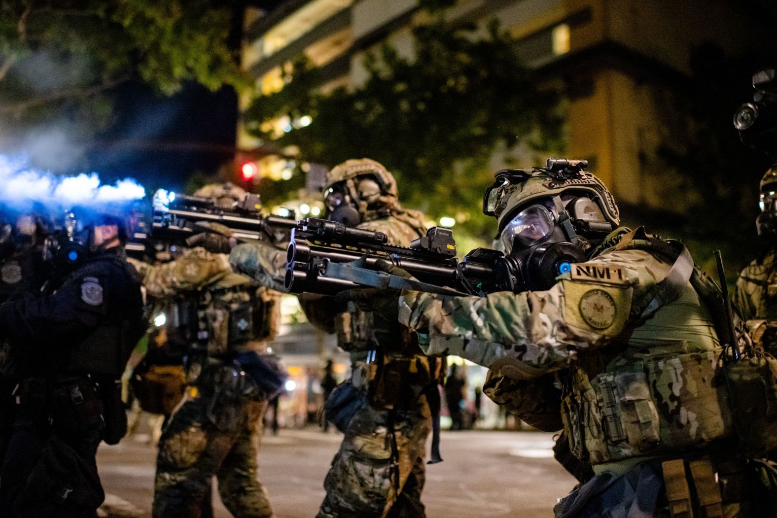 Federal officers attempt to clear the crowd on July 27.