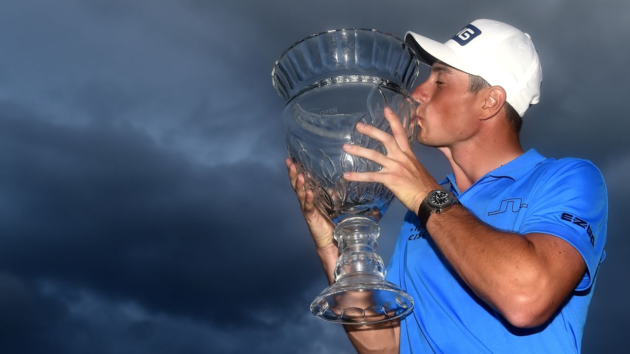 Hovland poses with the trophy after winning the Puerto Rico Open.