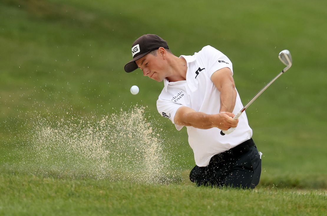 Hovland plays a shot from a bunker on the seventh hole during the final round of the Workday Charity Open.