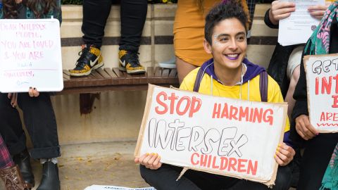 Intersex activist Pidgeon Pagonis protests outside the hospital in 2017.