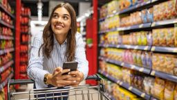 underscored grocery store woman shopping credit card