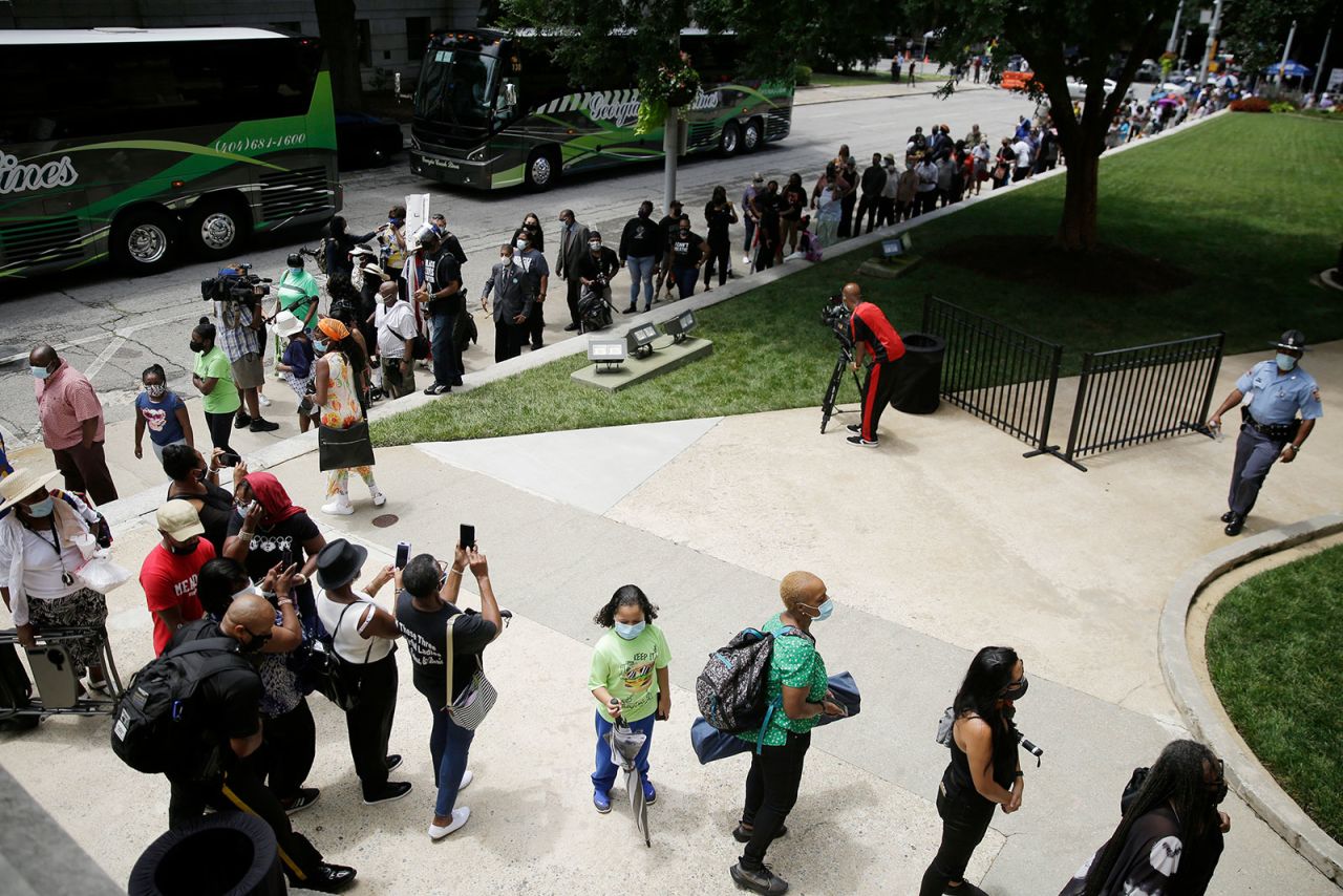 People stand in line to visit Lewis' casket in Atlanta.