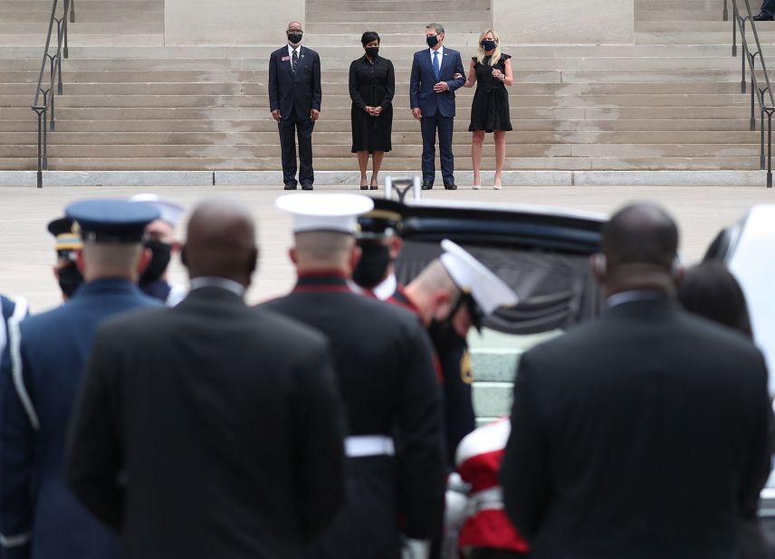 From left, Georgia state Rep. Calvin Smyre, Atlanta Mayor Keisha Lance Bottoms, Georgia Gov. Brian Kemp and Georgia first lady Marty Kemp wait for Lewis' casket at the steps of the Georgia Capitol on Wednesday.