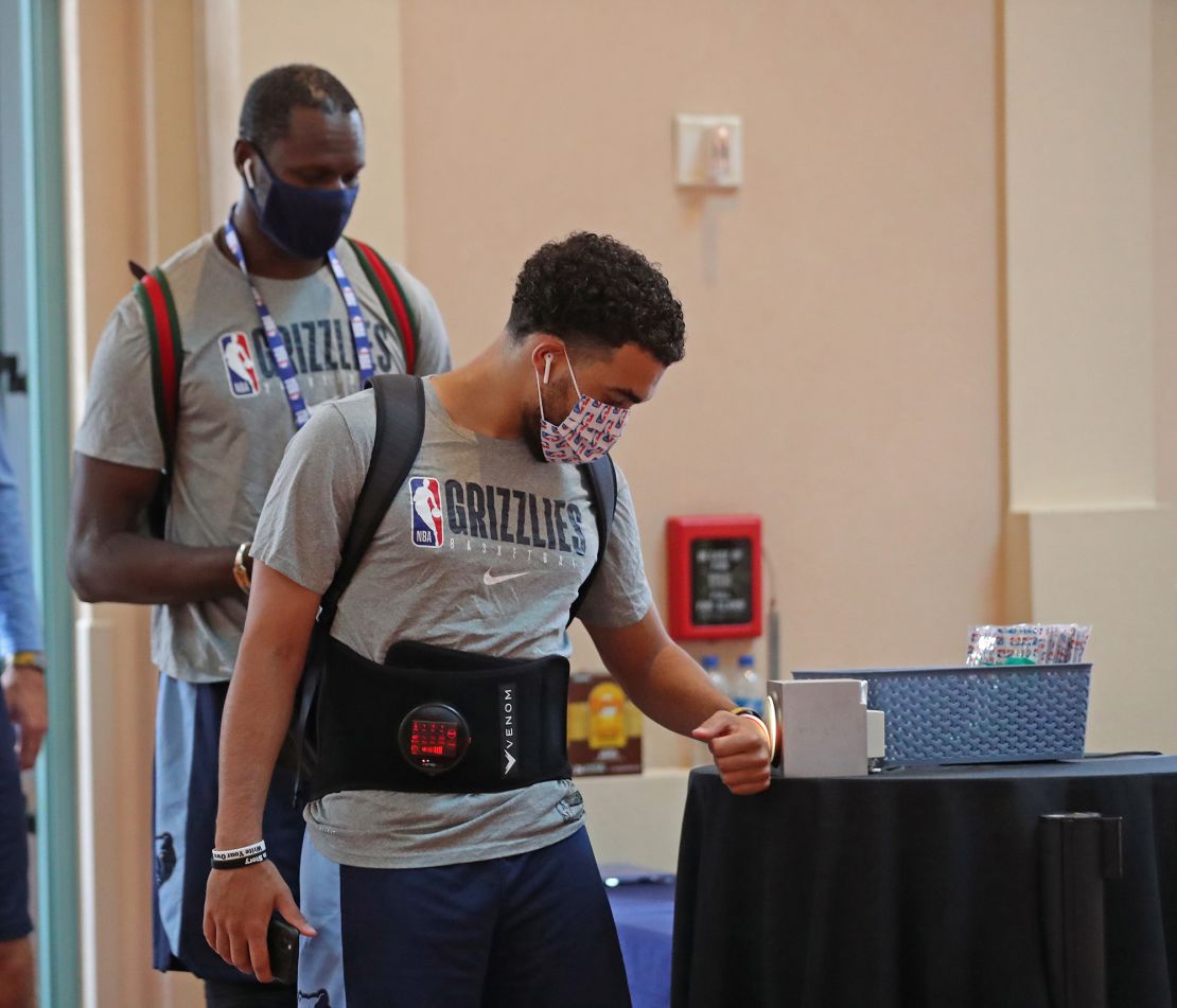 Tyus Jones #21 of the Memphis Grizzlies arrives during practice as part of the NBA restart 2020 on July 17, 2020 in Orlando, Florida.