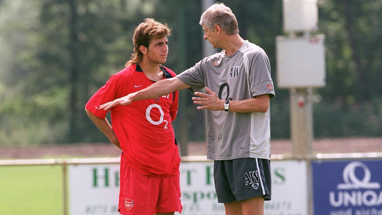 Fabregas talks to Arsenal manager Arsene Wenger during preseason training on July 24, 2004 in Bad Waltersdorf, Austria.