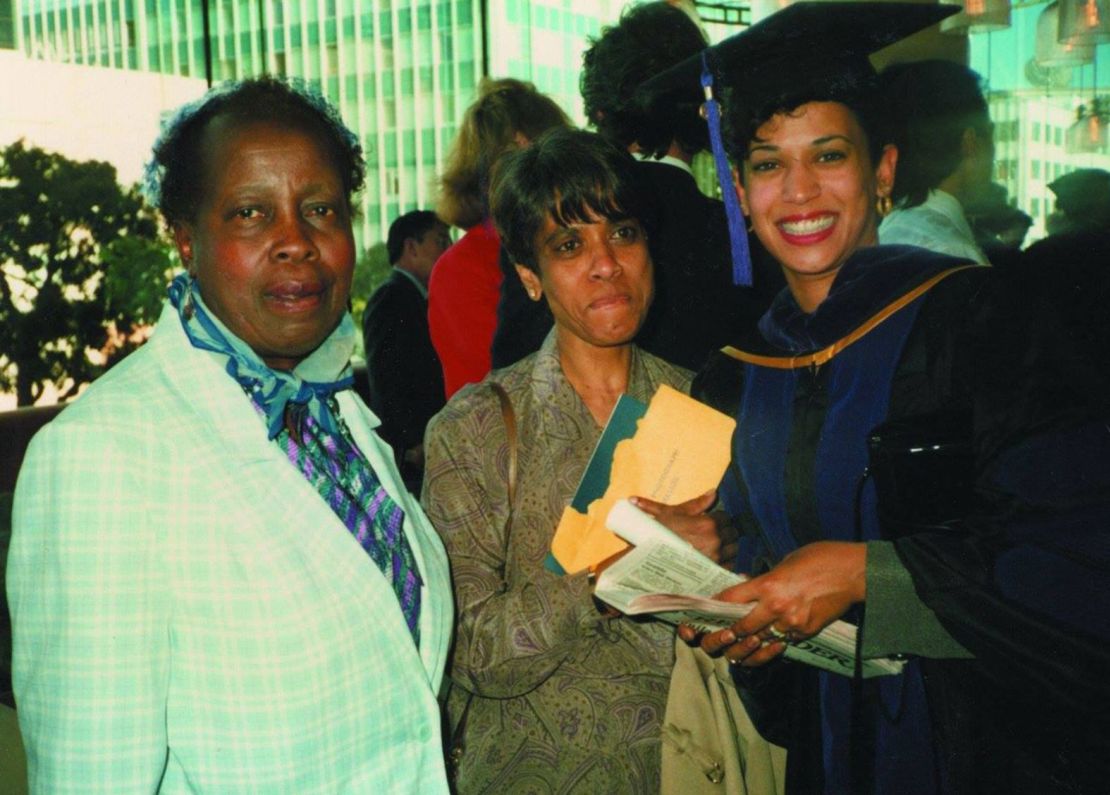 Harris, right, with her mother, center, and her first grade teacher after she graduated from law school in 1989.