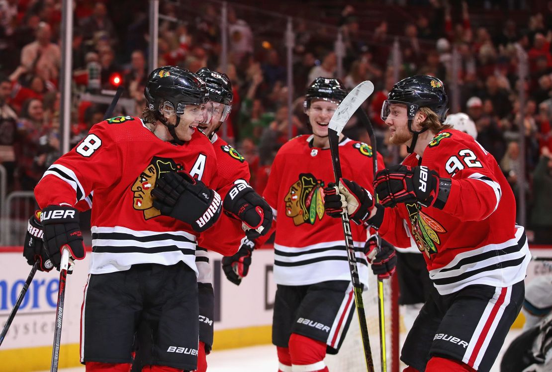 Members of the Chicago Blackhawks celebrate a goal on March 11, 2020, in Chicago.