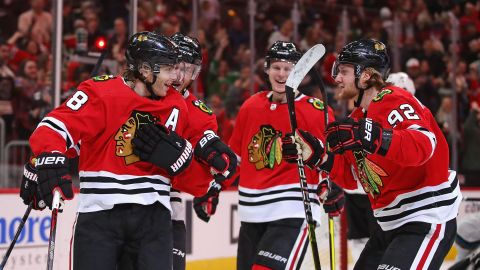 Members of the Chicago Blackhawks celebrate a goal on March 11, 2020, in Chicago.