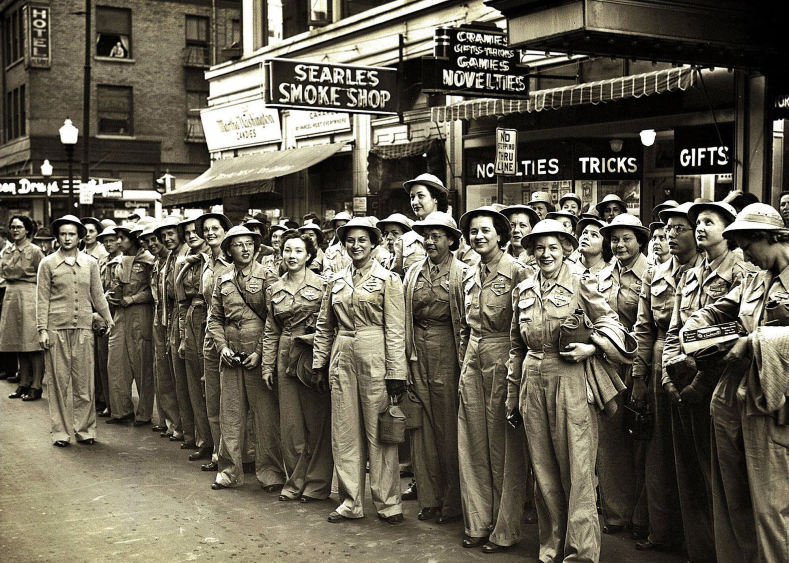 Women with the Army Auxiliary Corps wait for a trolley in downtown Des Moines, Iowa, five months after Congress passed a bill authorizing non-combat military duty for women. The 1942 legislation effectively allowed women to join the war effort in roles such as radio operators and air traffic controllers.