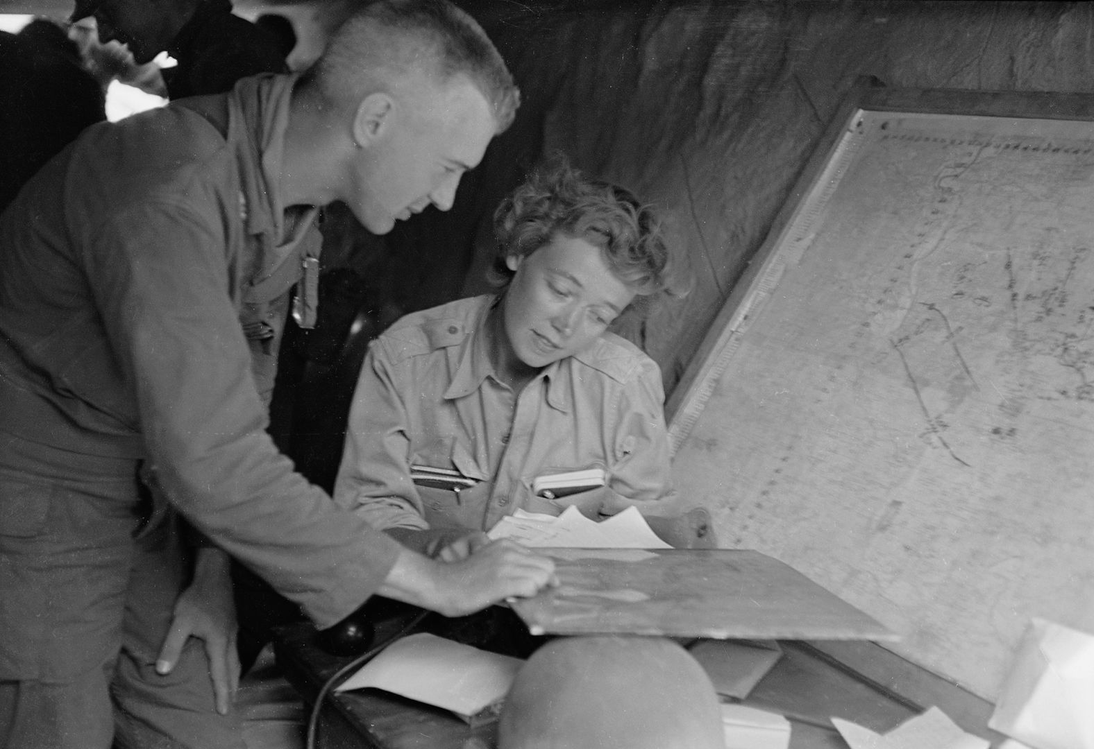 Reporter Marguerite Higgins was a trailblazer for female journalists and war correspondents. She covered the liberation of Dachau for the New York Herald Tribune during World War II, and she was one of the few women on the front lines during the Korean War. She's seen here going over notes with Col. John "Mike" Michaelis while on assignment in 1950. One year later, Higgins became the first woman to receive a Pulitzer Prize for international reporting. 